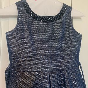 Stunning dress for little girl with beaded neckline and bow